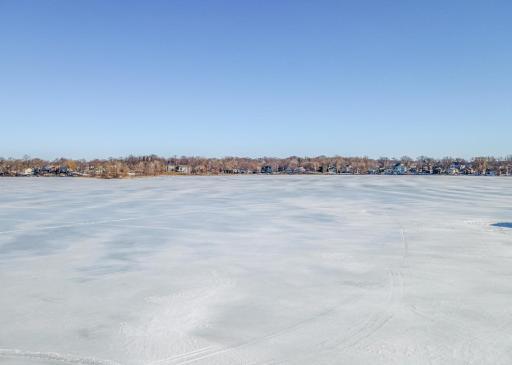 40' of hard bottomed sandy Lake Minnetonka shoreline with riprap to prevent erosion.