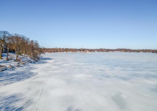 40' of hard bottomed sandy Lake Minnetonka shoreline with riprap to prevent erosion.