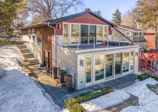 Stunning modern home located on Harrison Bay with a durable metal roof and custom galvanized steel siding.