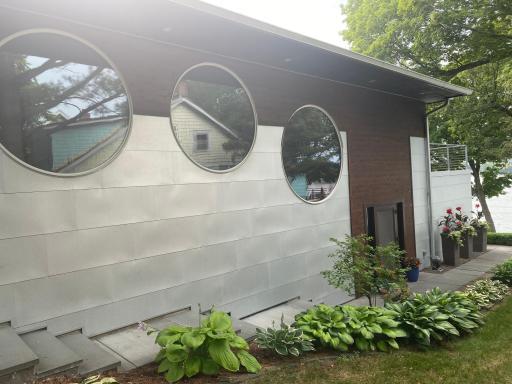 Natural light floods the home throughout the day with 6’ & 7’ tall circular windows on the East.