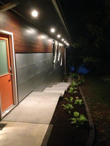 Gorgeous exterior lighting illuminating the front walkway