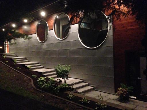 Gorgeous exterior lighting illuminating the front walkway