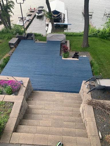 700 Sq Ft of outdoor living space (Cedar decking painted in Fall 2022), professionally designed and lush multi-tiered landscaping, and 2’ x 4’ Bluestone tile walkway/stairs leading to the lake.