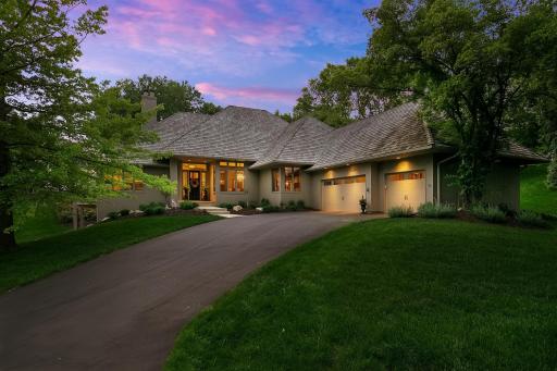 Exceptional one-story walkout perfectly situated on a gorgeous 0.53-acre lot with sensational views of Bryant Lake & incredible updates/upgrades throughout!