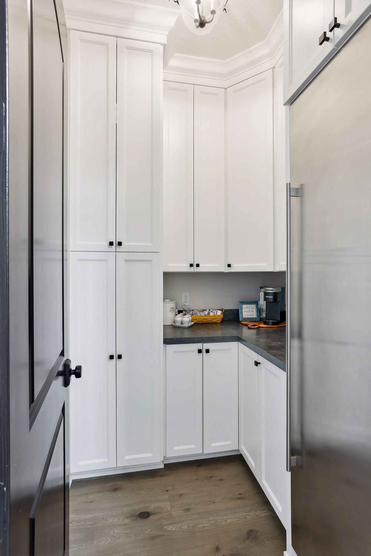Walk-in pantry adjacent to kitchen
