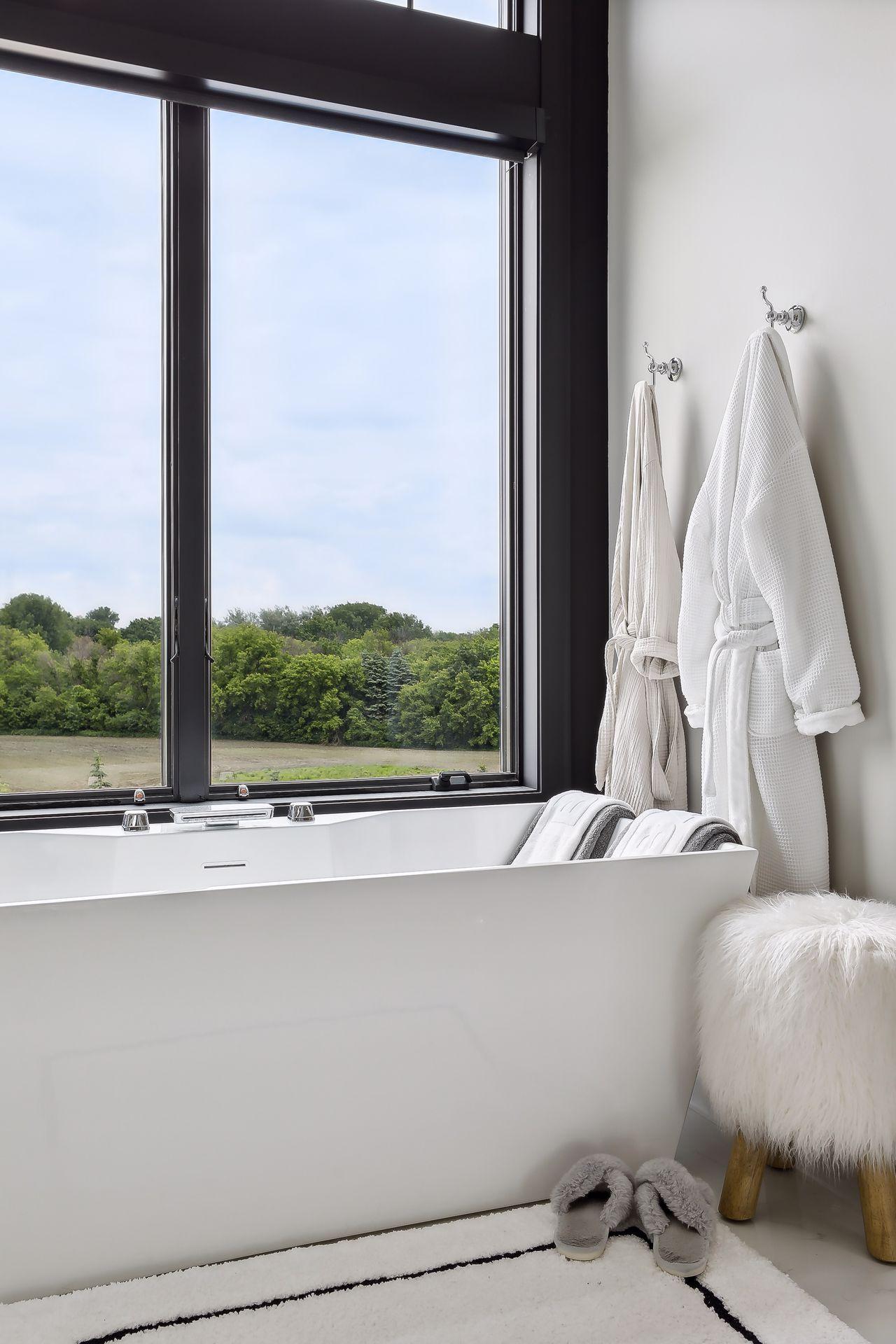 Steeping tub with views of yard and pool area