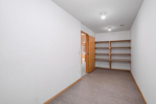 Lower level storage w built-in shelves - 14228 Heritage Ln.jpg