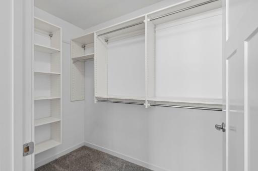 Owners walk in closet. Every closet , pantry and linen features upgraded laminate organizers.