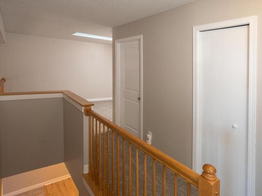 Oak banister to upstairs Loft and Bedrooms, Linen in hallway