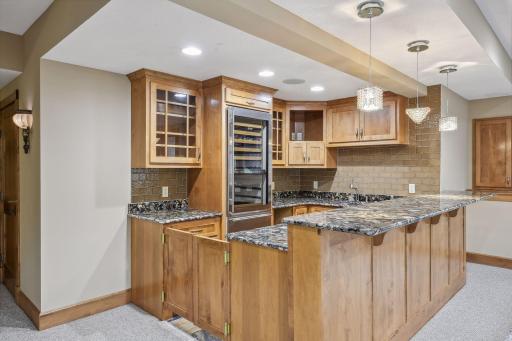 Basement Wet Bar with SubZero Wine Cooler, Microwave, Dish Washer and Sink