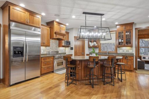Kitchen with Stainless Steel Commercial Appliances, Ceiling Speakers & Customer Cabinets