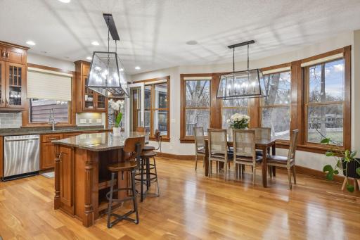 Kitchen Breakfast area with Large Granite Island & RH/ Lighting fixtures