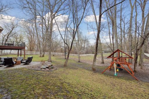 Kids Playset next to Firepit & Paver Patio Seating