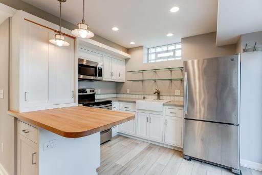Photo for 3424 Utah Avenue N, Crystal, MN 55427 - Listing #6354239 In-Law Kitchen with farm sink, custom inlay cabinets, SST appliances.