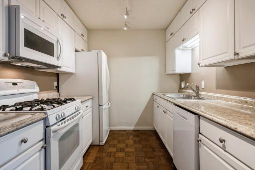 The sellers put in top-of-line appliances including a gas stove and refrigerator with ice maker. The cabinets are custom and contain a few pull-outs!