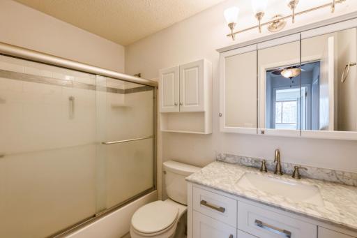 The bathroom was remodeled with granite counters, tile floor and beautiful new vanity.