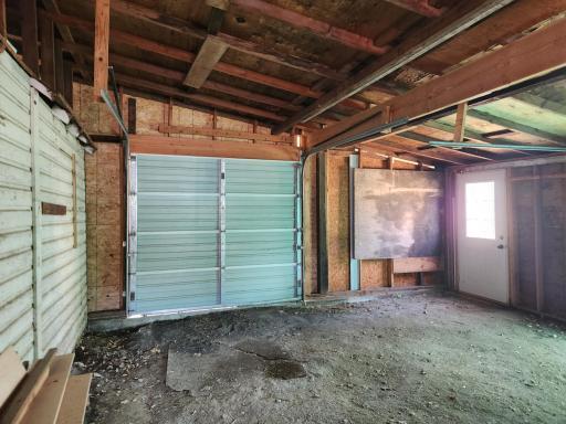 Photo for 205 N Main Street, Taunton, MN 56291 - Listing #6354878 Back entrance to garage features 8 x 8 ft overhead door.