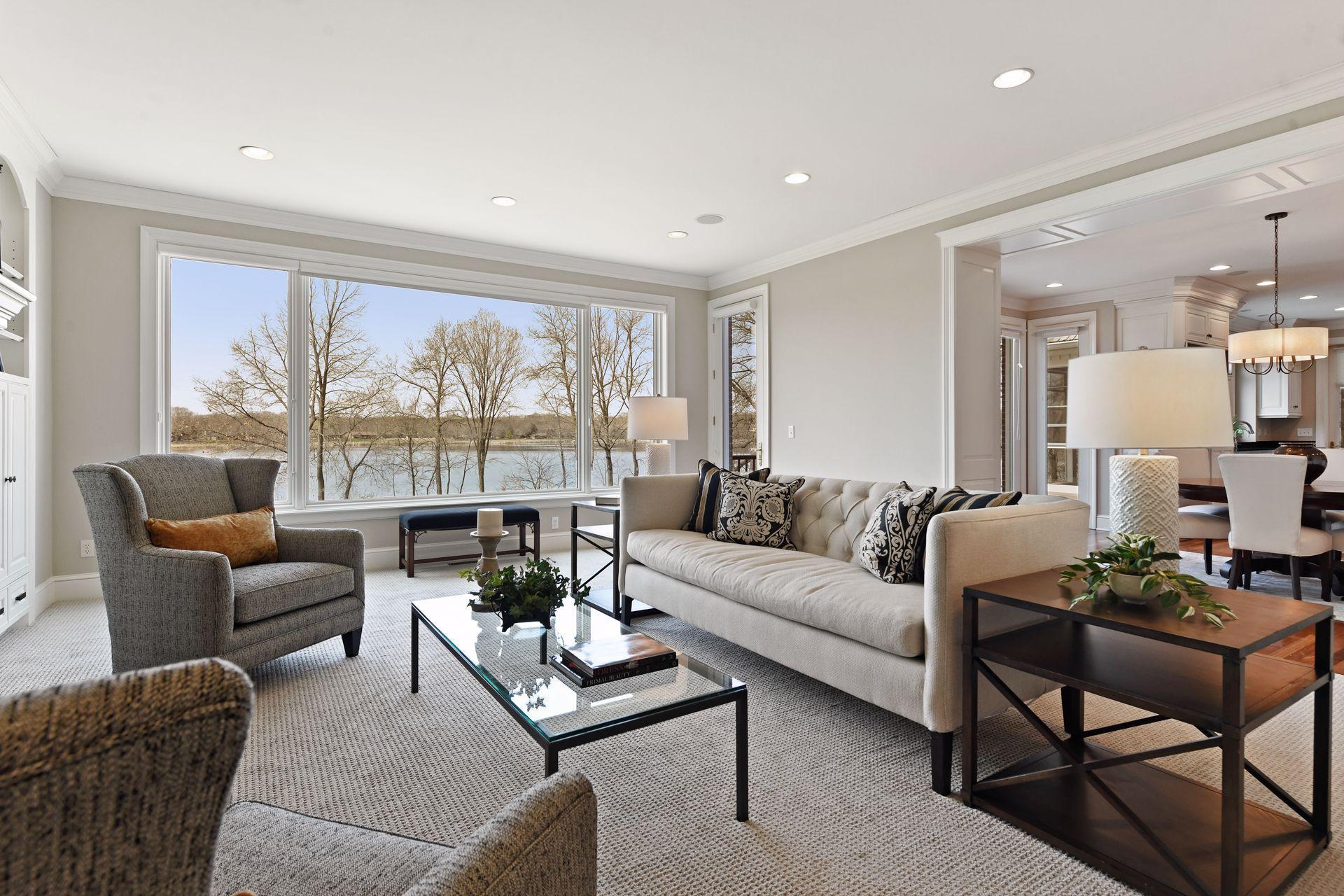 The room flows in the informal dining and kitchen areas as well as providing additional access to the upper balcony