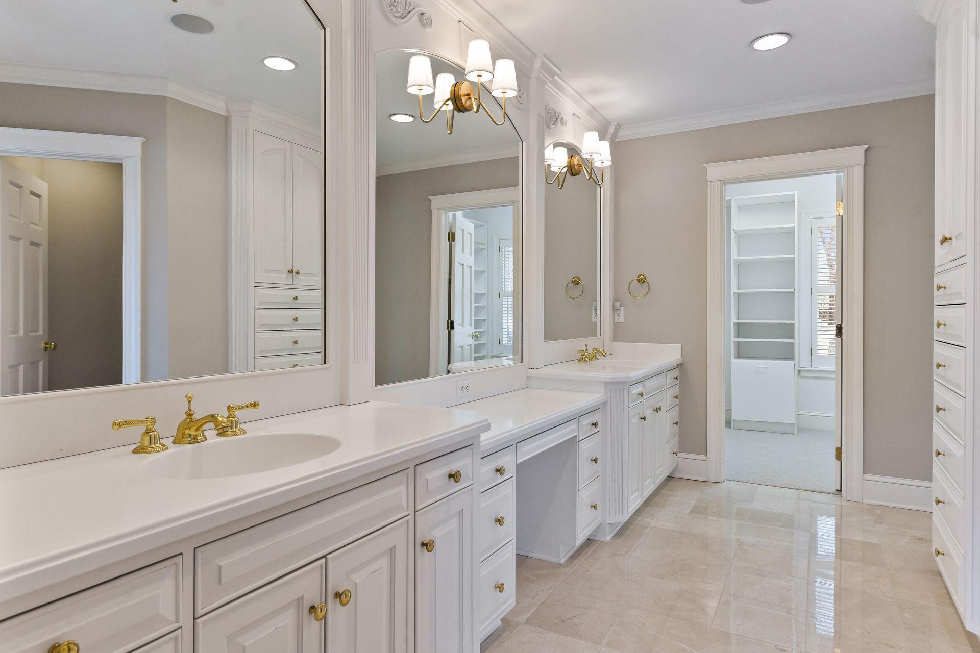 Dual sinks, separate make-up vanity, and plenty of storage space
