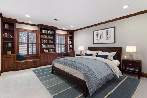 Three additional spacious bedrooms are found on the upper level; this one (Bedroom #2) features build-in bench seating and bookcases
