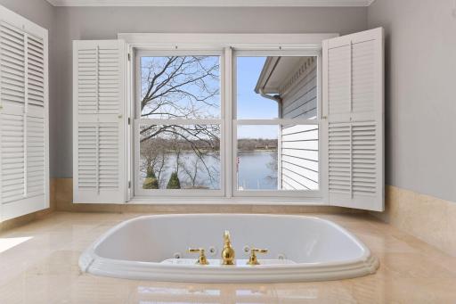 An oversized whirlpool tub is found in a private room within the owner's bath; separate walk-in shower