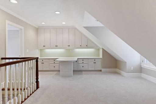 A built-in desk at theupper landing is ideal for a quiet homework space
