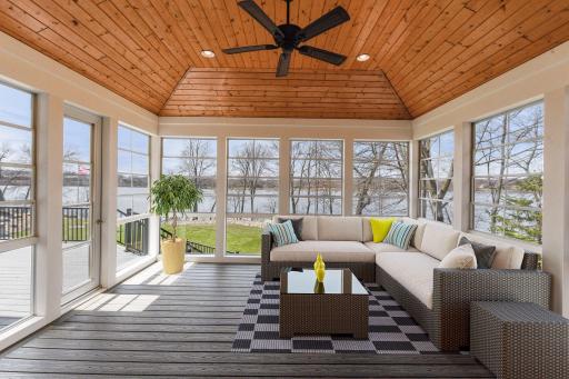 Enclosed seasonal porch is the perfect spot to lounge