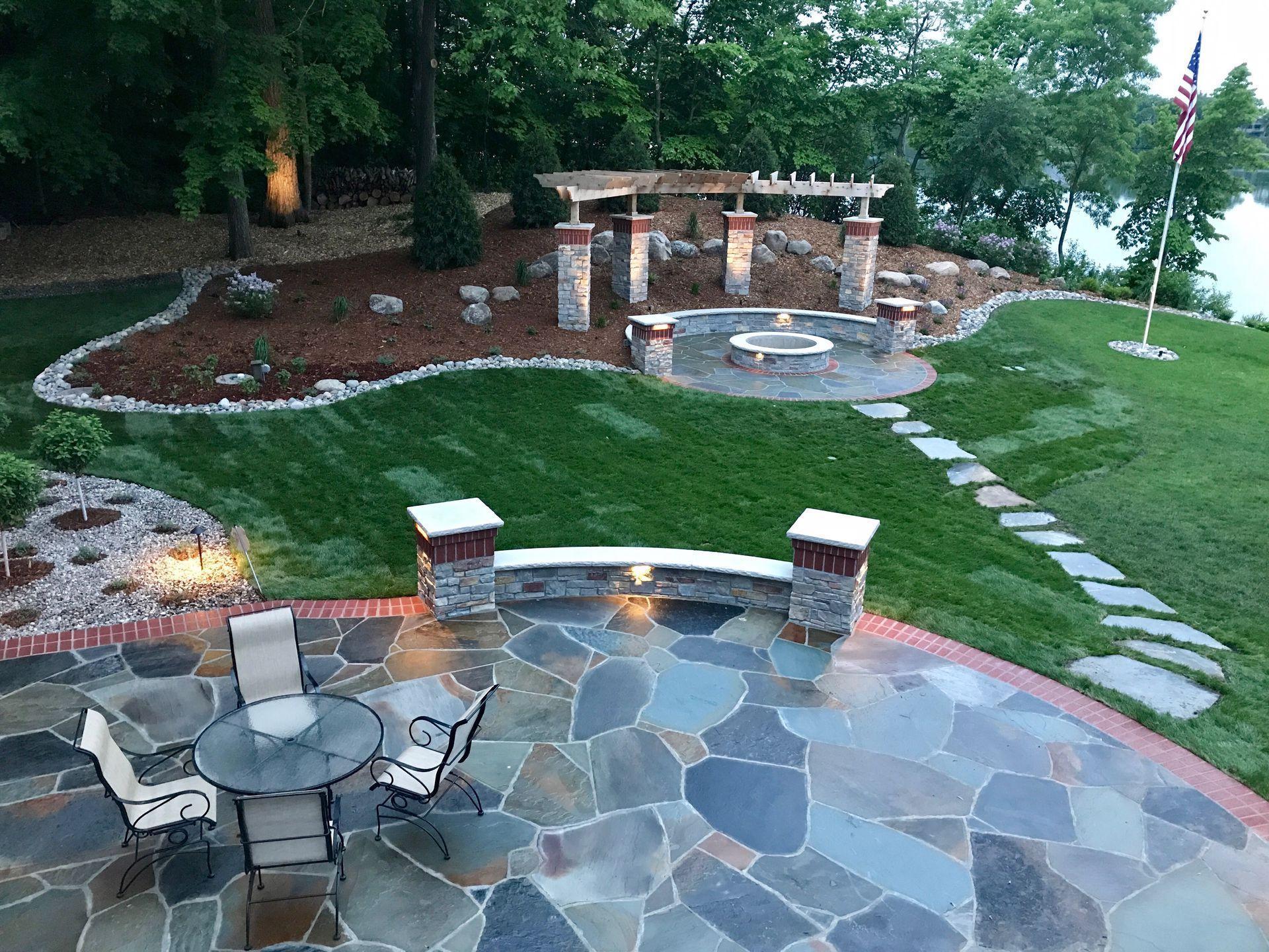 Exquisite landscaping and stone work sets the backdrop for outdoor entertaining