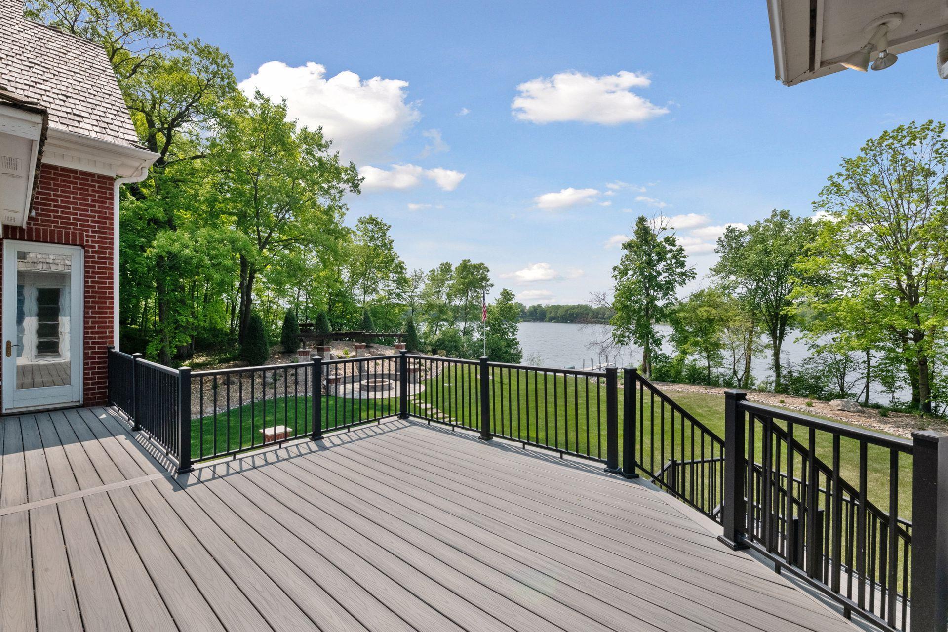 An aerial view of the spacious backyard and lakeshore