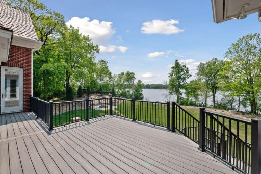 An aerial view of the spacious backyard and lakeshore