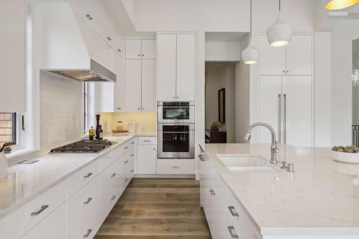 The refrigerator, large Kohler sink, and plenty of drawers for storage make this kitchen a delight to cook in.