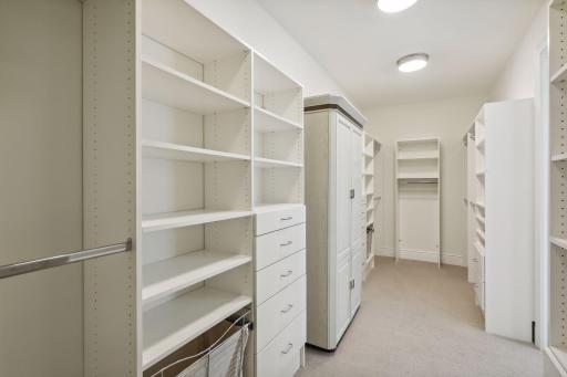 The enormous closet has a professional organization system.