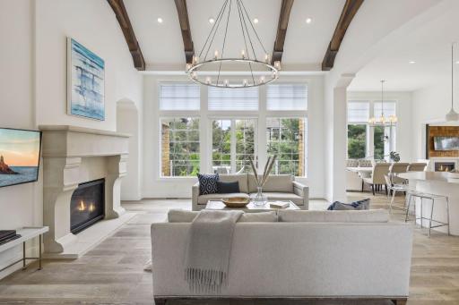This grand space features large windows that let in plenty of natural light. The light illuminates all of the unique features that this room has to offer.