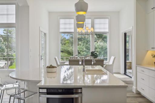 Just off the kitchen is the formal dining room. Tall windows bring in tons of natural light.