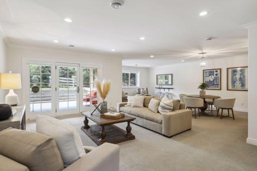 This level is a walk-out to the covered patio, which is made of concrete with stone stairs leading to the yard.