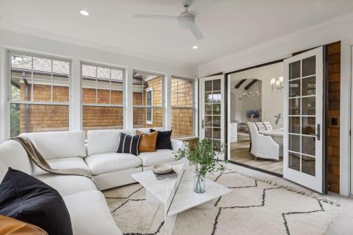 Venture to the four-season porch after dinner to unwind or enjoy your morning cup of coffee. The wall of surrounding windows gives the impression of enjoying the outdoors from the comfort of your home. An exterior door leads to the deck.