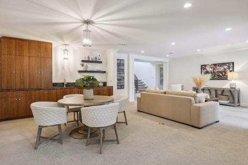 The lower level of the home features a family room, and the rooms are finished with crown molding for an added touch of elegance.