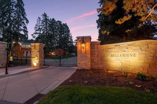 As you approach the entrance of the stunning Bellerieve community, your eyes are immediately drawn to the exquisite entrance. Elegant limestone walls add a touch of grandeur and the striking wrought iron gates provide security and exclusivity.