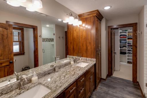 Well designed with dual sinks, walk-in tile shower and beautiful granite counter!