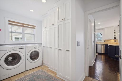 Spacious main floor laundry with plentiful storage