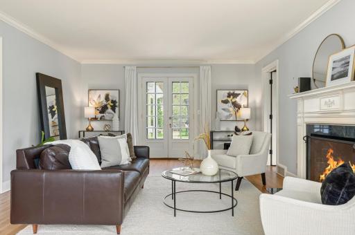 French doors lead to expansive paver patio and backyard.