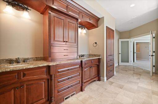 Ensuite bathroom offers an oversized jetted soaking tub, separate tiled walk-in shower, dual sinks, abundant storage and more!