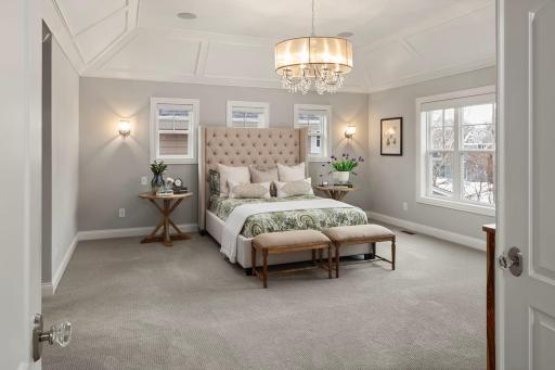 Luxurious ownerâs suite with coffered ceilings, walk-in closets, furniture quality vanity and dual shower and soaking tub.