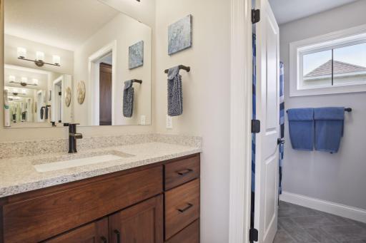 The additional 2 bedrooms upstairs share a full bathroom