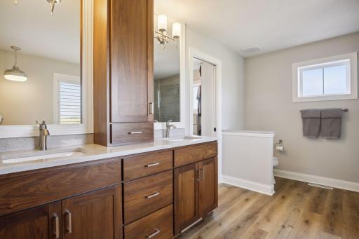 Gorgeous hickory cabinets continued in master bathroom!