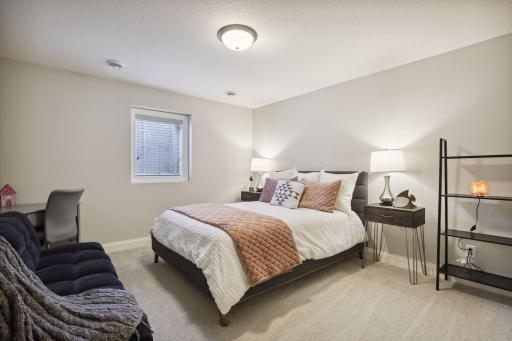 The 4th bedroom is located in the lower level and includes a large walk in closet