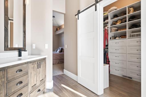 Custom closet in primary suite bathroom with plenty of storage