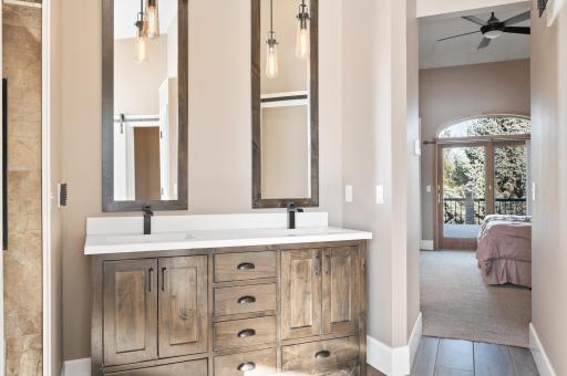 Dual vanity in primary suite, with 11 foot ceilings you really feel the height!
