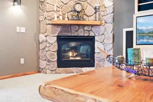 Imagine cozy nights around this stone fireplace
