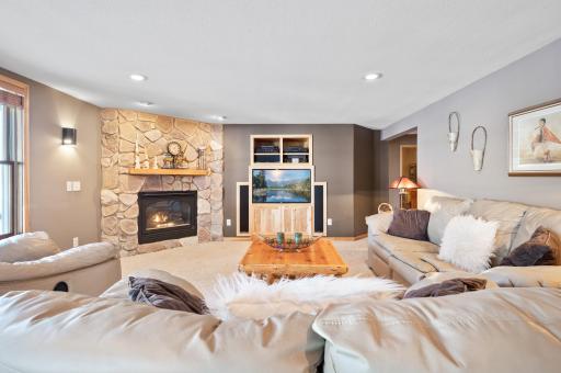 Gas brick fireplace brings so much warmth to this family room